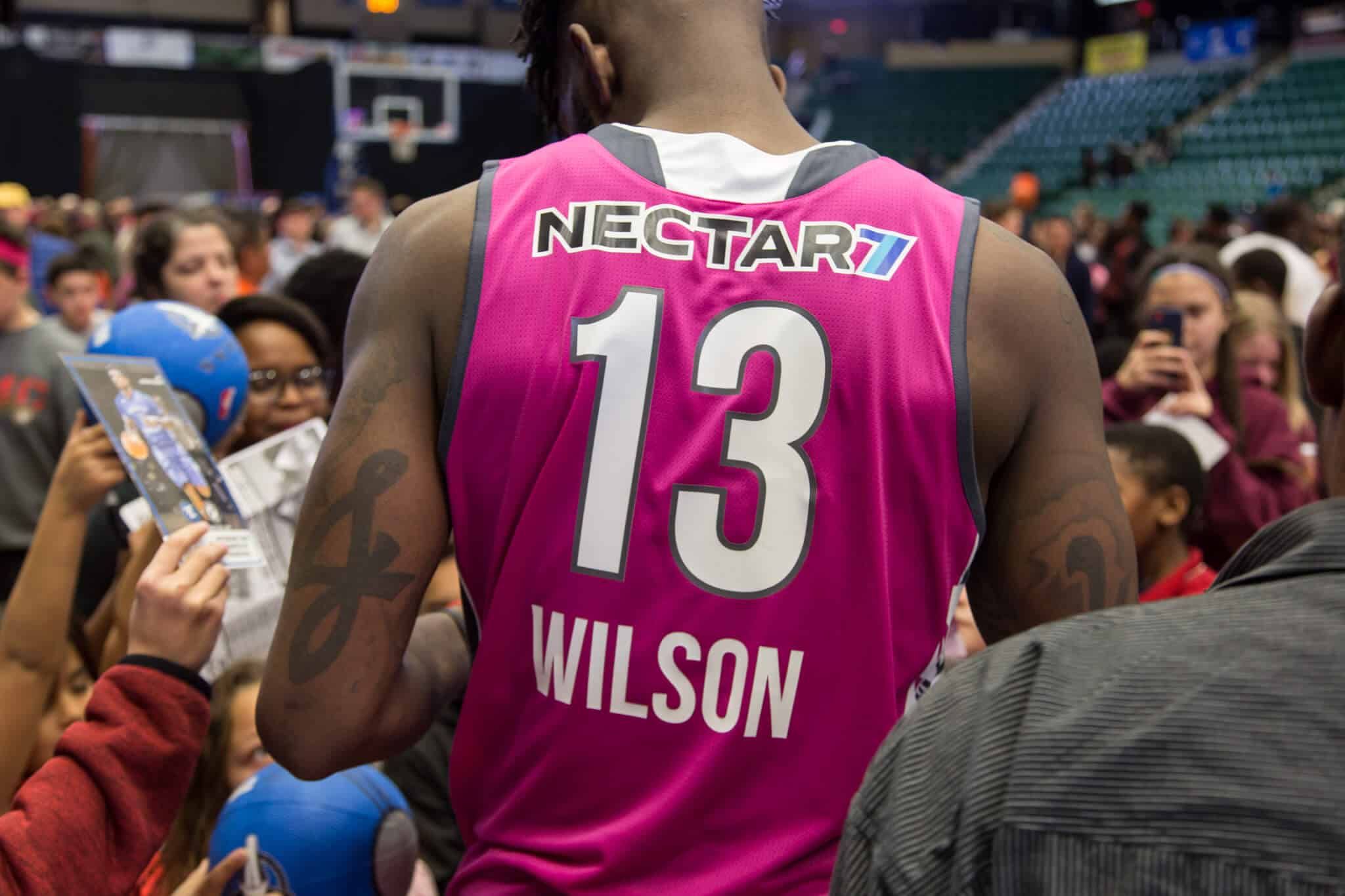 Back of Jamil Wilson showing his pink jersey and number 13