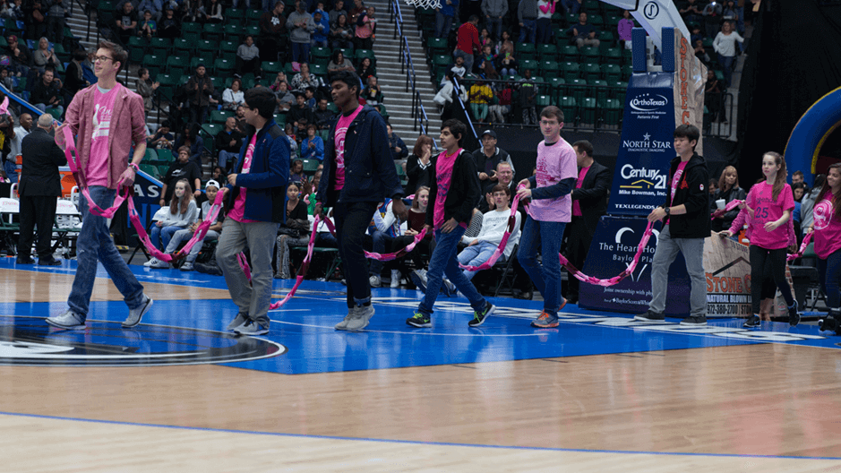 Fans enter the court in support of National Breast Cancer Foundation 
