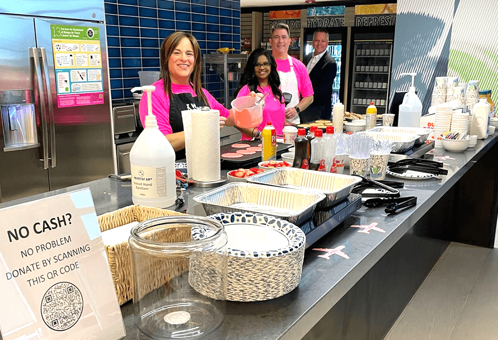 Brian's team at Signature Aviation in their annual Breast Cancer Awareness Day selling baked goods 