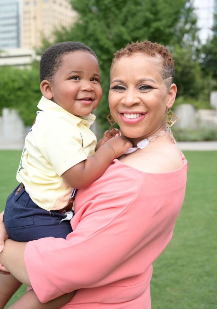 Teague with his grandmother holding him