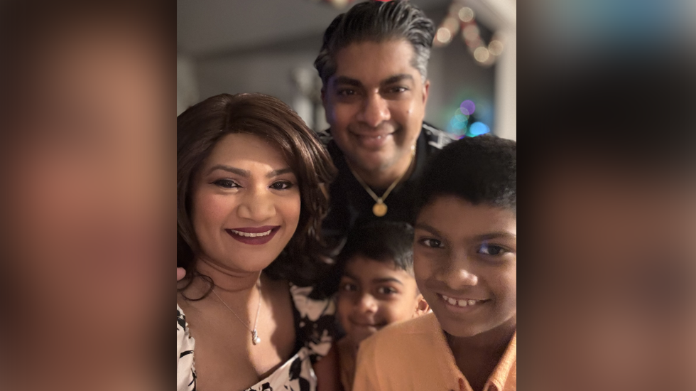 Photo of Anuradha with her husband and two of her sons