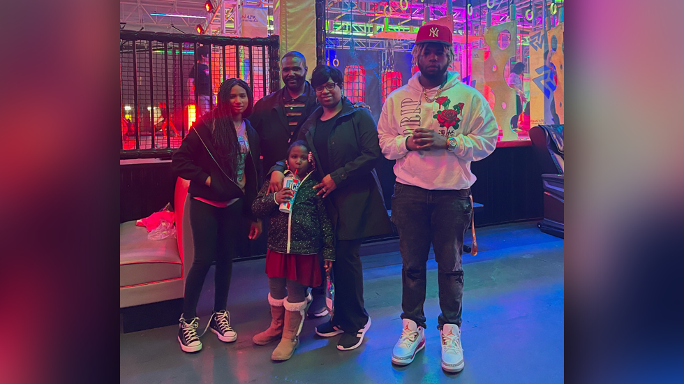 Photo of Jonathan with his wife and three children