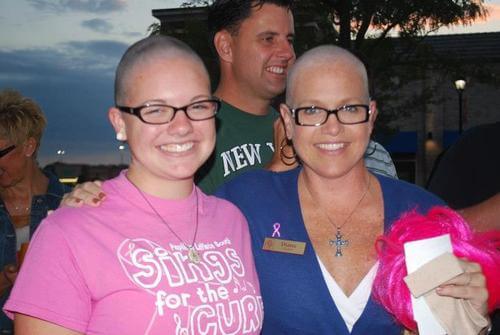 Diana and family member with their heads shaved