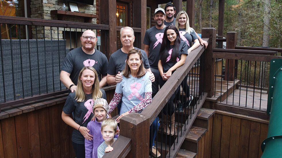 Amy's family and mom all dressed up with pink ribbon shirts 