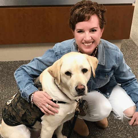 Emily with a labrador dog