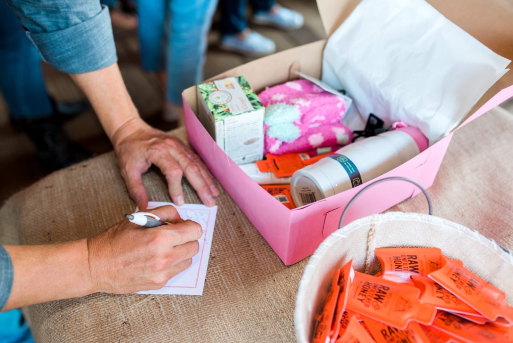 Woman signing card on a HOPE kit 