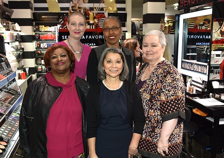 Survivors pose for a photo in Sephora 